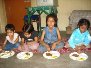 Children eating at RADHA Children's Home